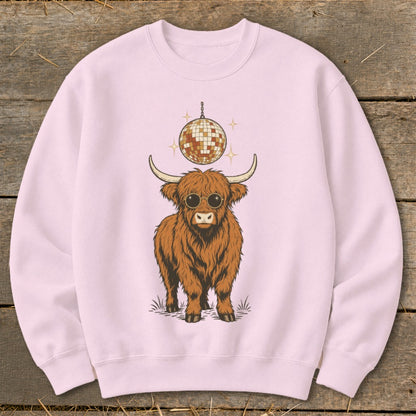 Fluffy Highland cow wearing sunglasses with a disco ball above.