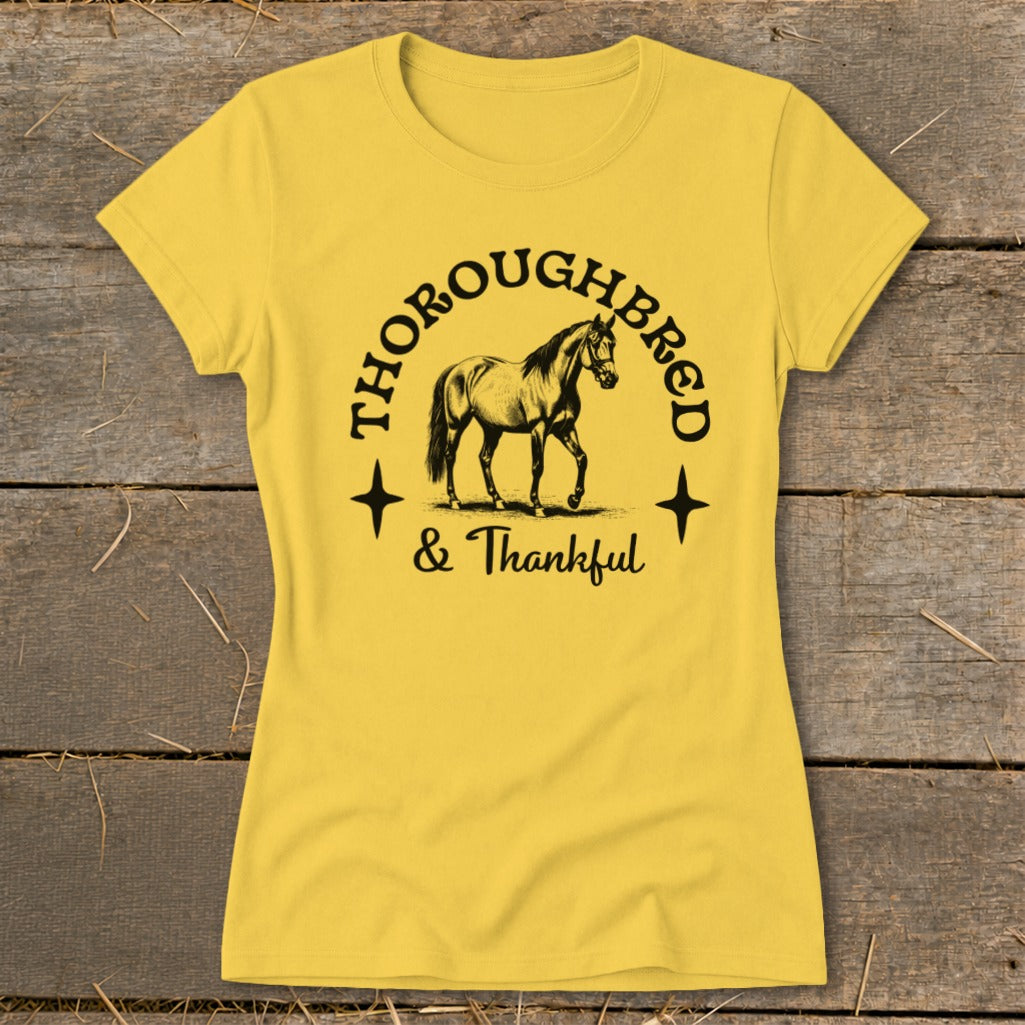 Yellow t-shirt with "Thoroughbred & Thankful" text and a horse graphic.