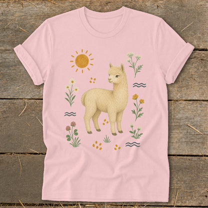 Pink t-shirt with a light-colored alpaca surrounded by flowers, sun, and waves.