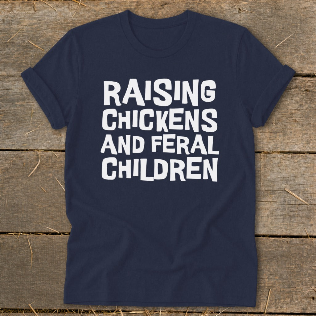 Navy t-shirt with white text "Raising Chickens and Feral Children".