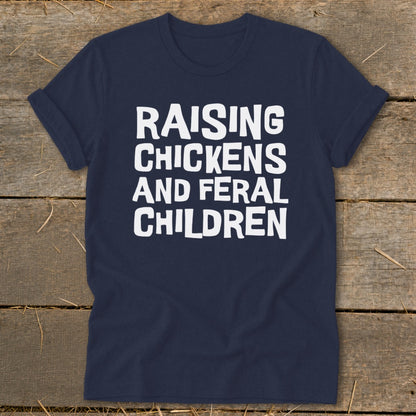 Navy t-shirt with white text "Raising Chickens and Feral Children".