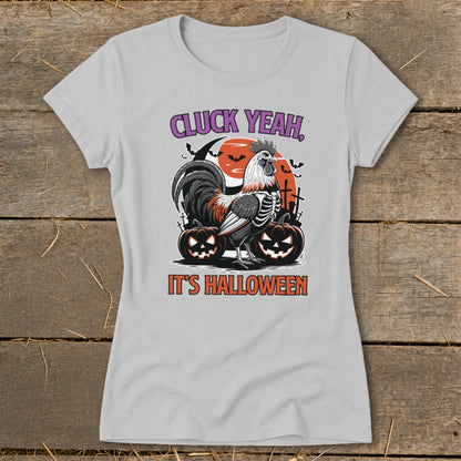 Skeleton rooster with pumpkins and text "Cluck Yeah, It's Halloween".