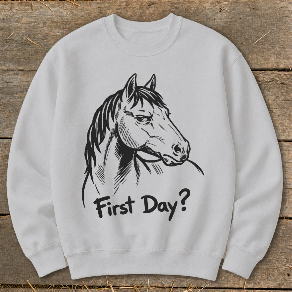 White sweatshirt with a black line drawing of a horse's head and the text "First Day?".