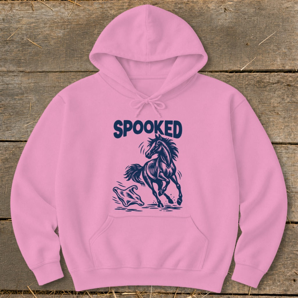 Pink hoodie with navy blue graphic of a startled horse and ghost, reading "SPOOKED".