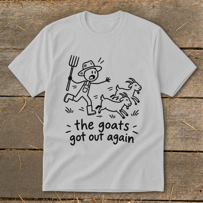 Light grey t-shirt with a stick figure farmer chasing goats and text "the goats got out again".