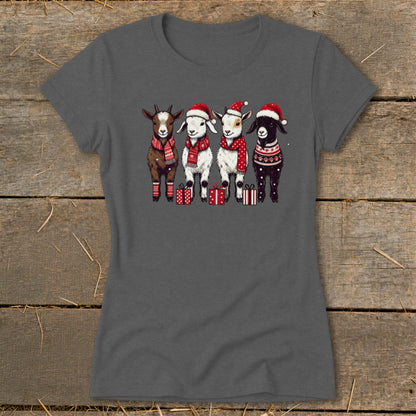 Four cartoon goats in Santa hats and scarves stand in a row with gifts.