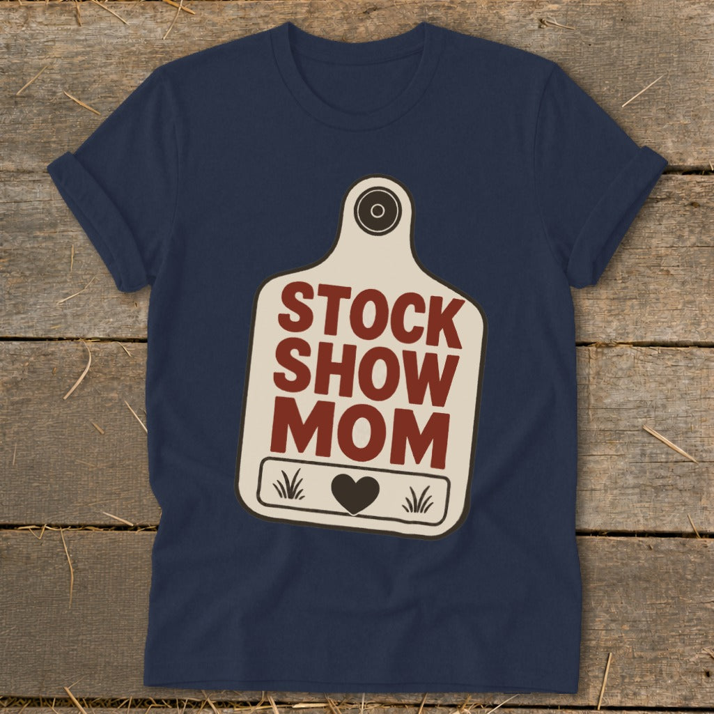 Navy t-shirt with a cow tag graphic that reads "STOCK SHOW MOM".