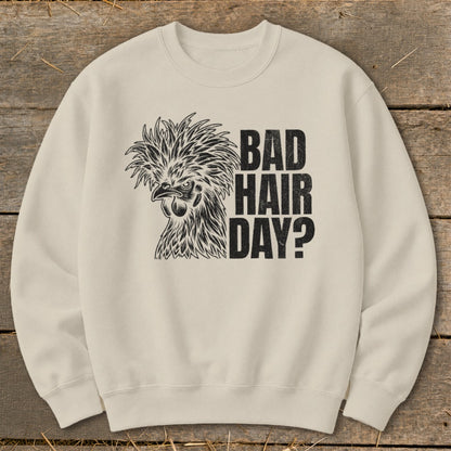 Cream sweatshirt with black graphic of a chicken and text "BAD HAIR DAY?".