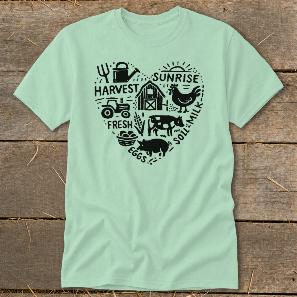 Light mint t-shirt with heart design of farm animals, tractor, and harvest text.