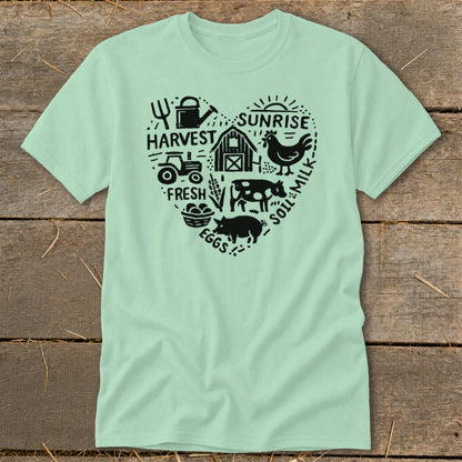 Light mint t-shirt with heart design of farm animals, tractor, and harvest text.