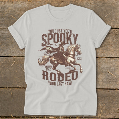 White t-shirt with "Spooky Rodeo" design featuring a grim reaper on a horse.