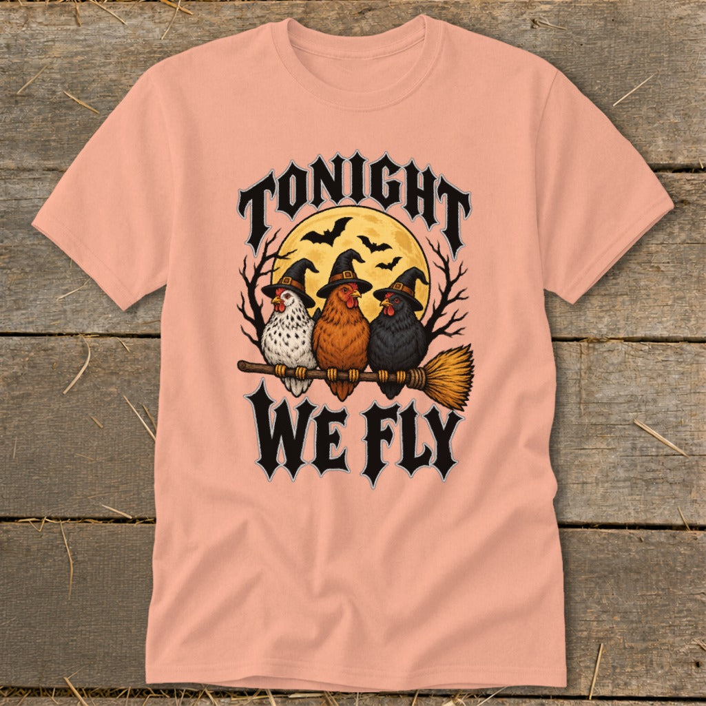 Three chickens wearing witch hats ride a broomstick with text "TONIGHT WE FLY".