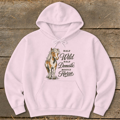 Pink hoodie with a brown and white horse graphic and text "Half Wild Half Domestic Mostly Horse".