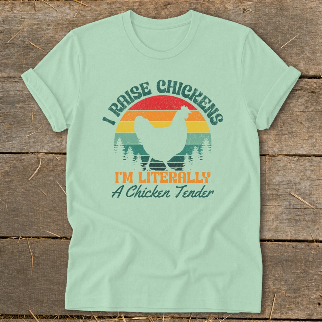 Light green t-shirt with "I Raise Chickens I'm Literally A Chicken Tender" text and chicken silhouette.