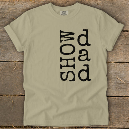 Tan t-shirt with black text "SHOW dad".