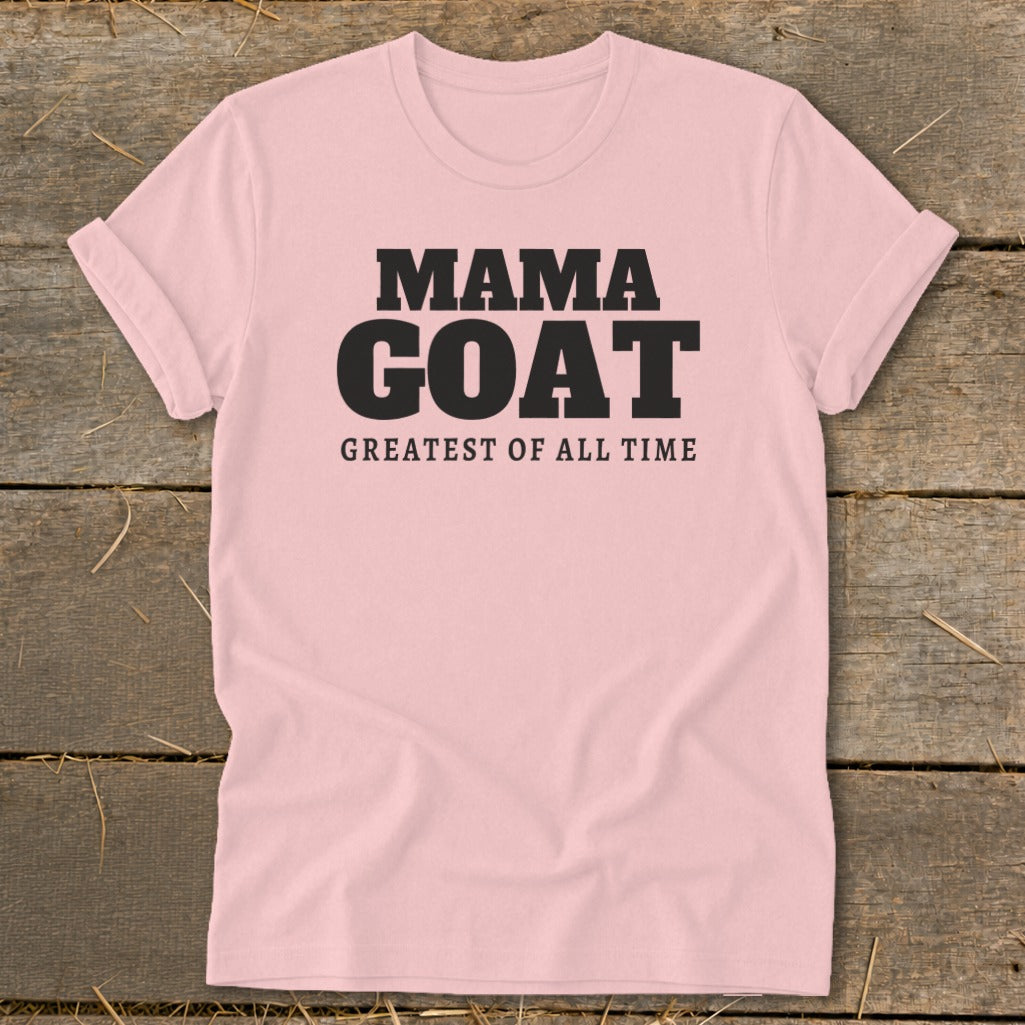 Pink t-shirt with black text that reads "MAMA GOAT GREATEST OF ALL TIME".