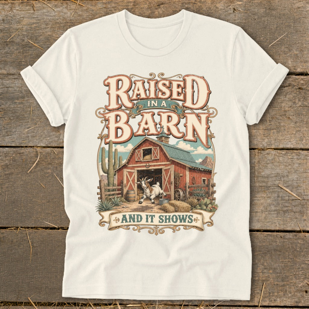 "Raised in a Barn and It Shows" text over a barn with a goat and desert landscape.