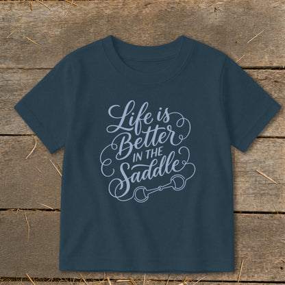 Dark blue t-shirt with "Life is Better IN THE Saddle" graphic and horse bit.