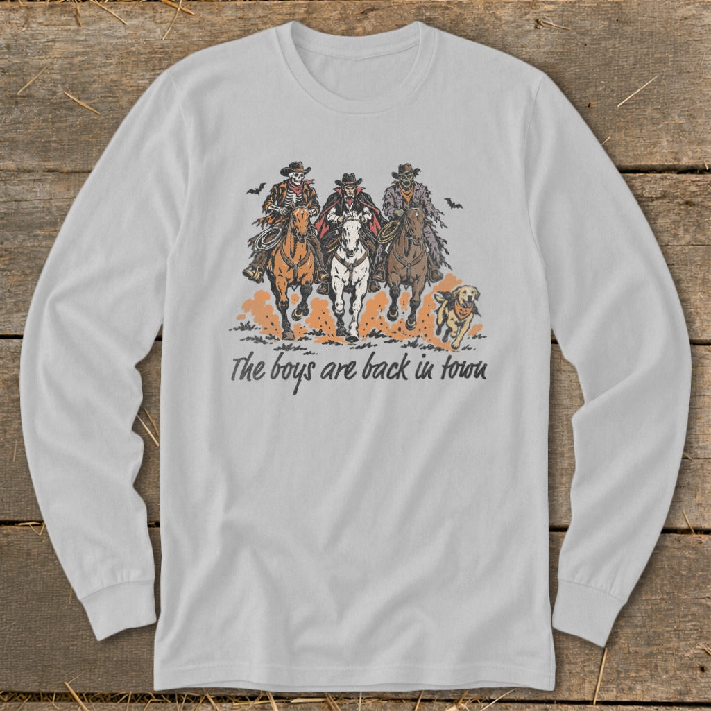 Graphic with skeleton, vampire, zombie cowboys on horses, dog, and text "The boys are back in town."