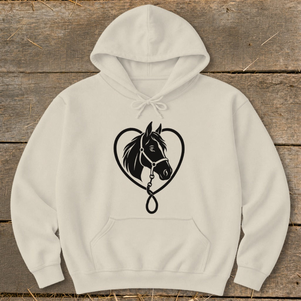 Cream-colored hooded sweatshirt featuring a black graphic of a horse head inside a heart on a rustic wooden background.