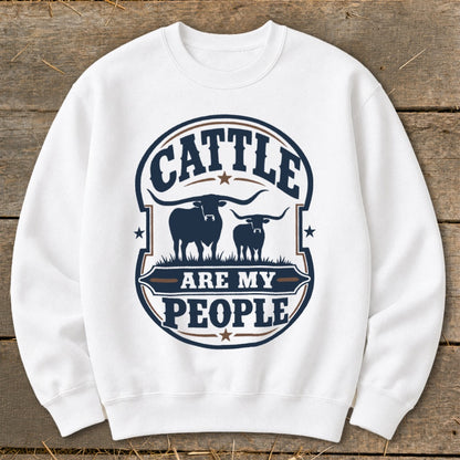 White sweatshirt with a graphic that reads "Cattle Are My People" with longhorn cattle.