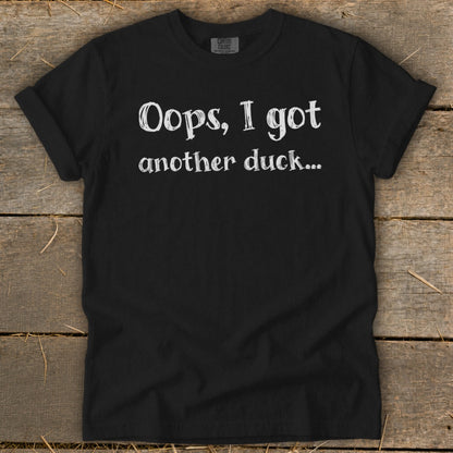 Black t-shirt with white text "Oops, I got another duck..."