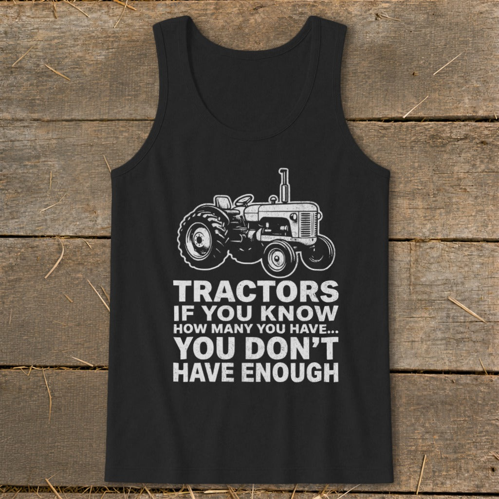 Black tank top with white tractor graphic and text: "Tractors if you know how many you have... you don't have enough"