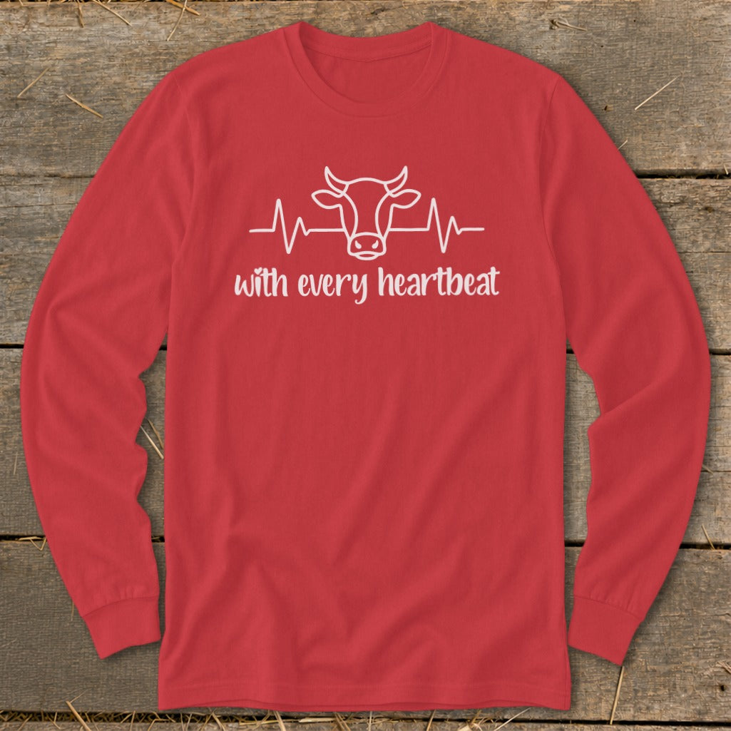 Red long-sleeved shirt with a white cow and heartbeat graphic and text.