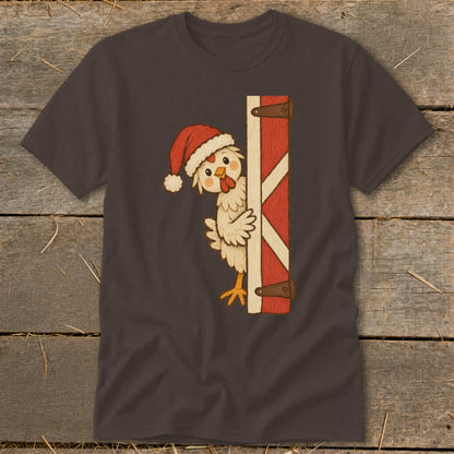 Chicken wearing Santa hat peeking from behind red barn door.