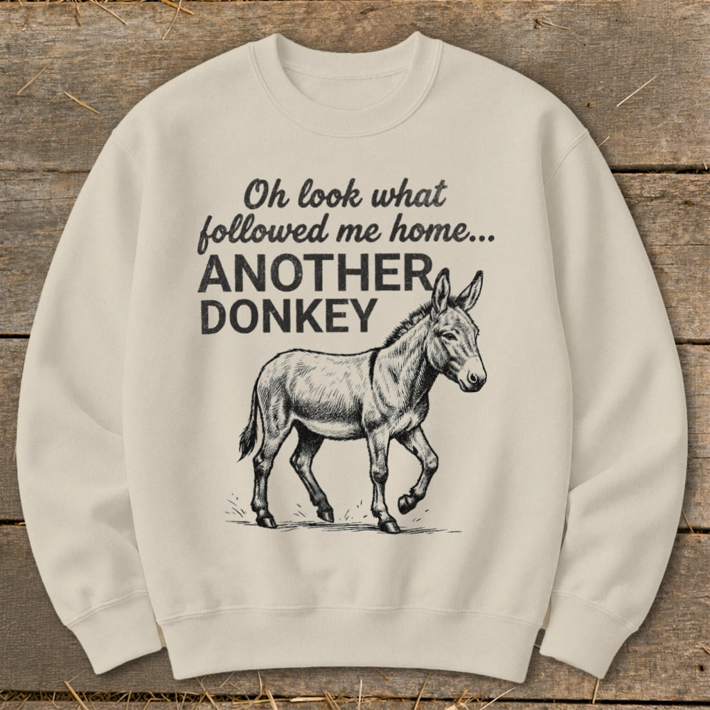 Cream sweatshirt with donkey graphic and text "Oh look what followed me home... ANOTHER DONKEY".