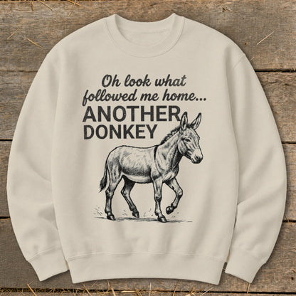 Cream sweatshirt with donkey graphic and text "Oh look what followed me home... ANOTHER DONKEY".