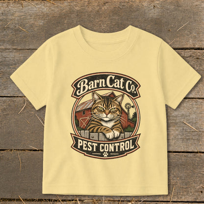 A light yellow t-shirt features a vintage graphic of a tabby cat and a barn with the text Barn Cat Co. Pest Control.