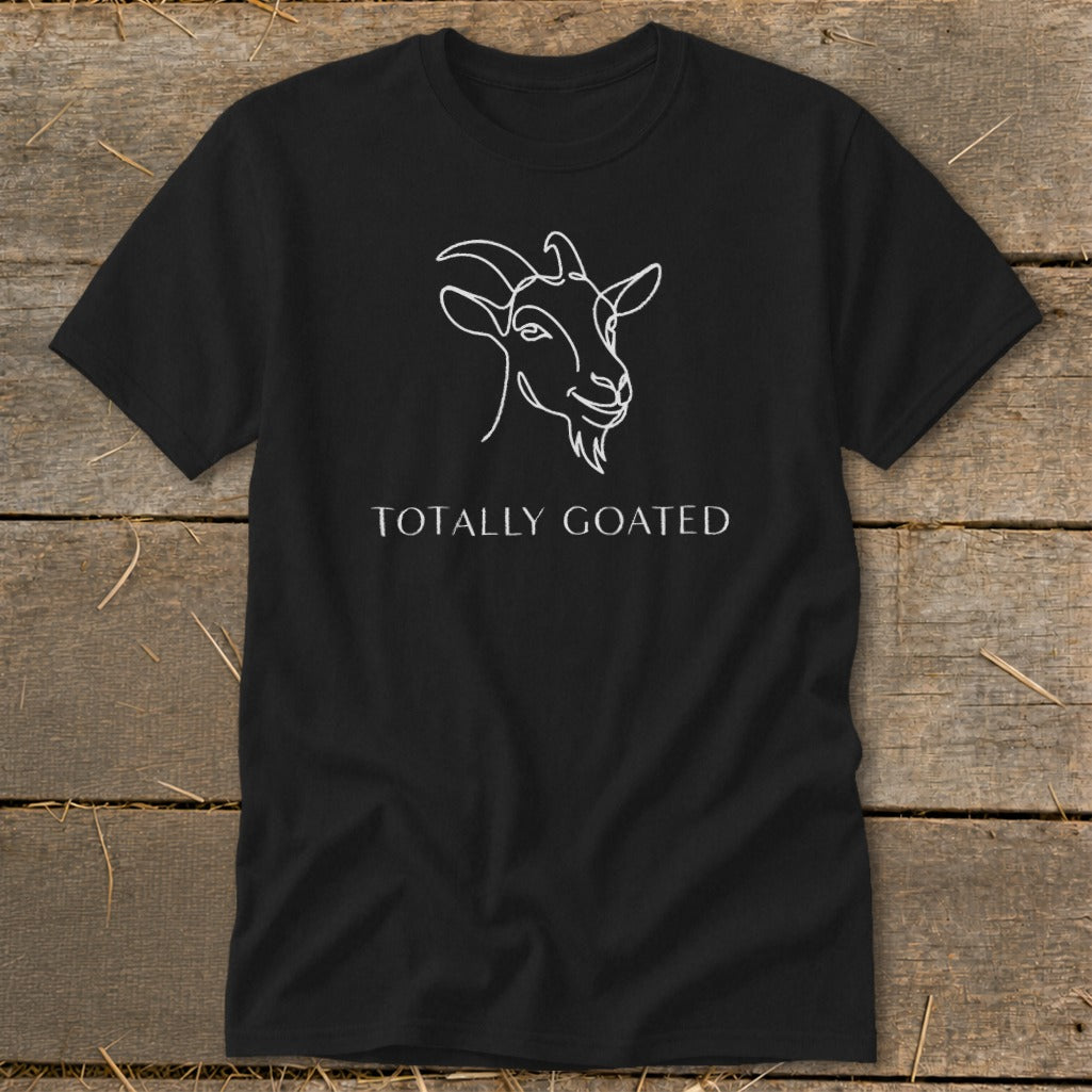 Black t-shirt with white line art goat head and "TOTALLY GOATED" text.