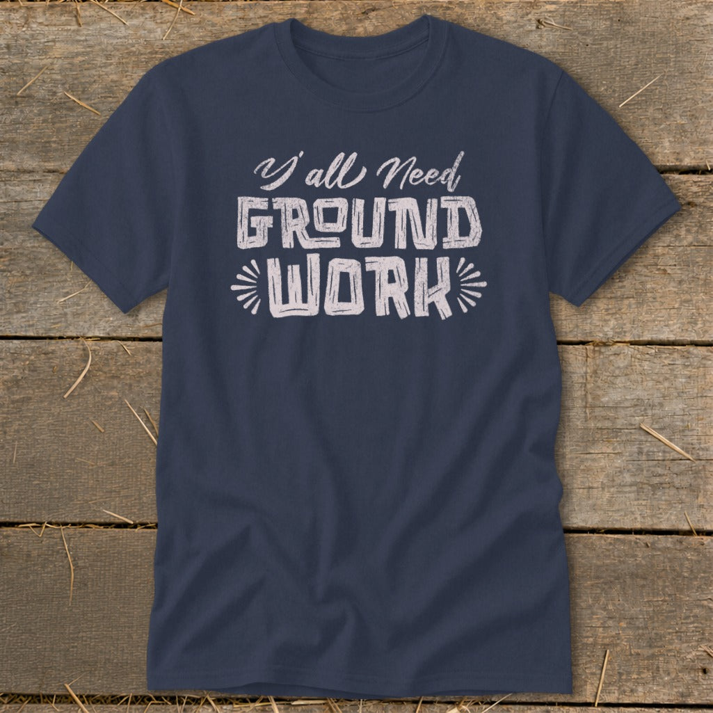 Navy t-shirt with distressed text reading "Y'all Need GROUND WORK"