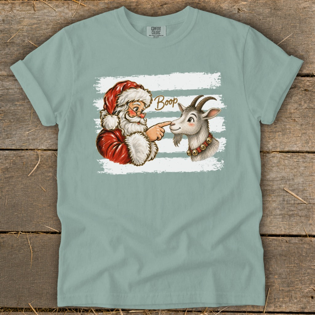 Santa Claus booping a goat with the word "Boop" above.