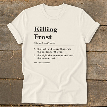 Off-white t-shirt with rolled sleeves laid flat, featuring black text defining "Killing Frost" dictionary-style.