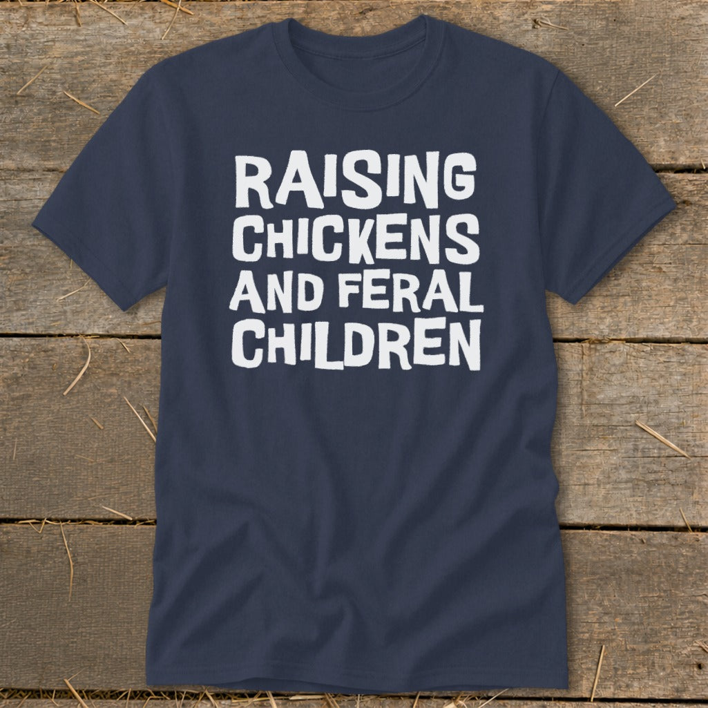 Navy t-shirt with white text reading "RAISING CHICKENS AND FERAL CHILDREN".