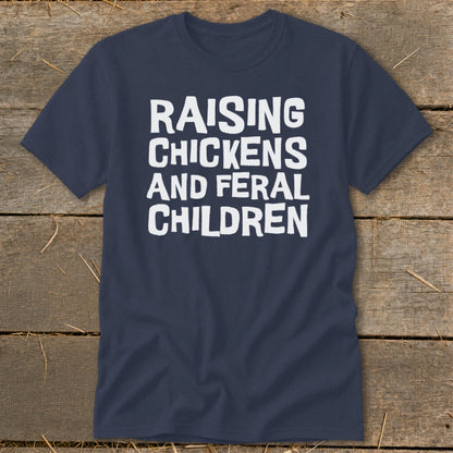 Navy t-shirt with white text reading "RAISING CHICKENS AND FERAL CHILDREN".