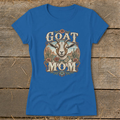 Blue t-shirt with "Goat Mom" text and a goat head illustration with desert scenery.