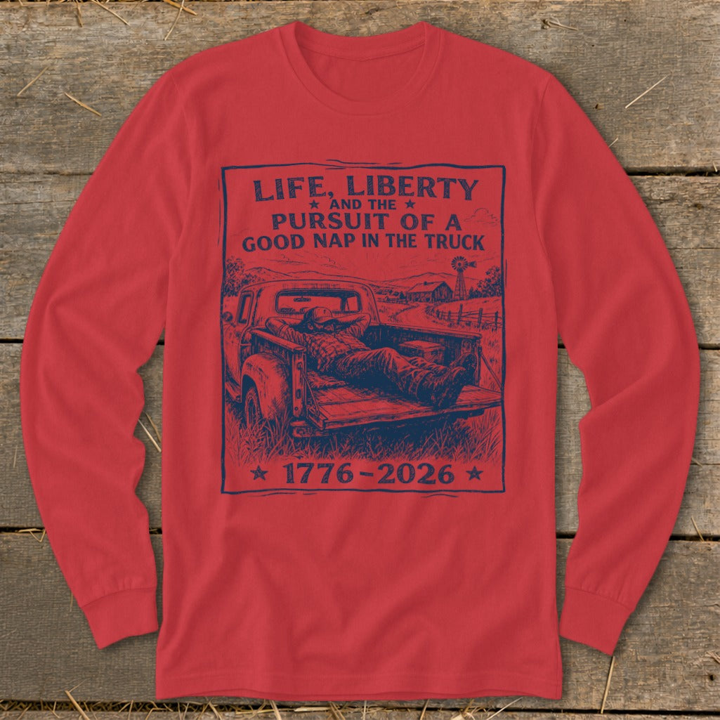 Red long sleeve shirt with "Life, Liberty, and the Pursuit of a Good Nap in the Truck" graphic.