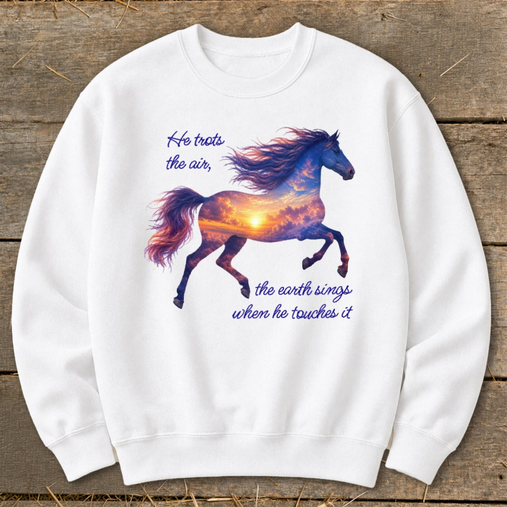 A white crewneck sweatshirt features a graphic of a running horse filled with a sunset sky and text that reads, He trots the air, the earth sings when he touches it.