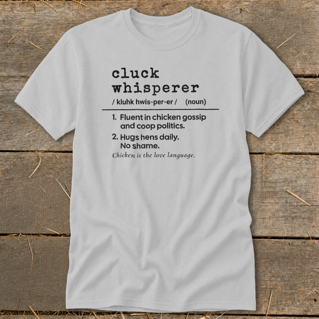 Gray t-shirt with "cluck whisperer" definition and chicken-related phrases.