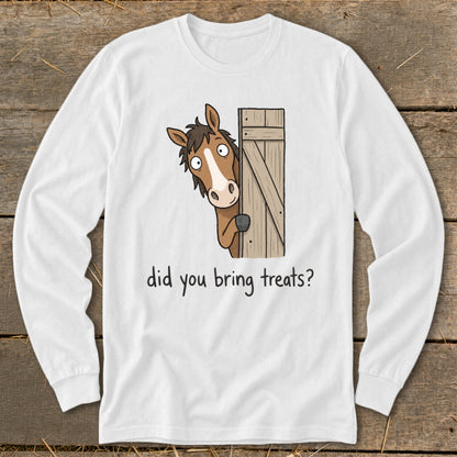 White long-sleeve shirt with cartoon horse peeking from a wooden gate, asking "did you bring treats?".