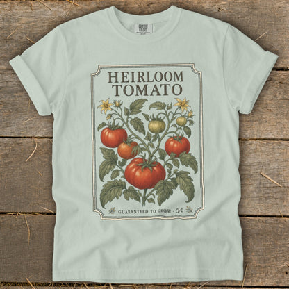 Light blue t-shirt with "Heirloom Tomato Guaranteed to Grow" graphic.