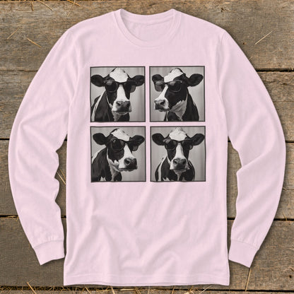 Four black and white portraits of cows wearing sunglasses on a pink long-sleeve shirt.