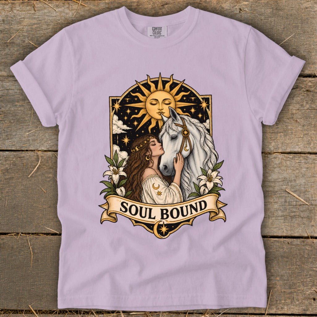 Woman kissing a white horse with sun and stars in decorative frame, text "Soul Bound".