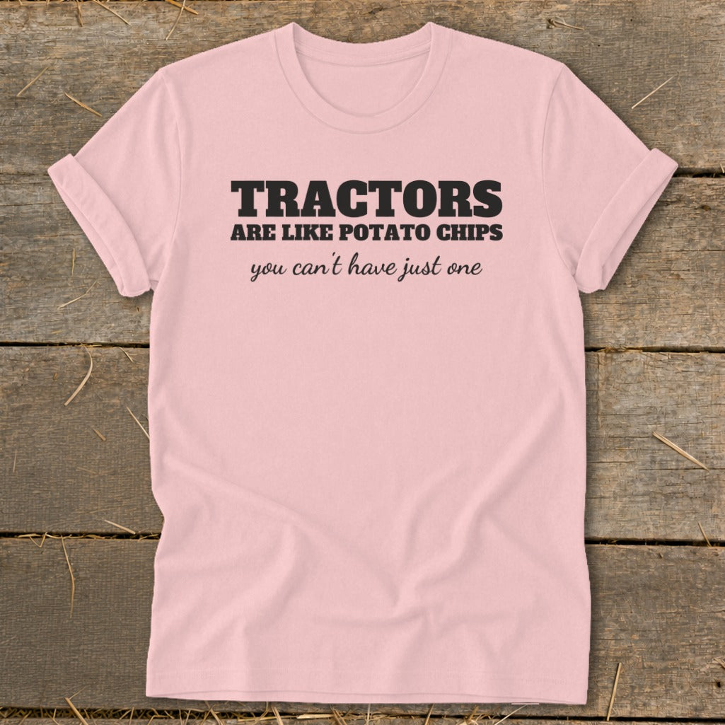 Pink t-shirt with black text that reads "TRACTORS are like potato chips you can't have just one."