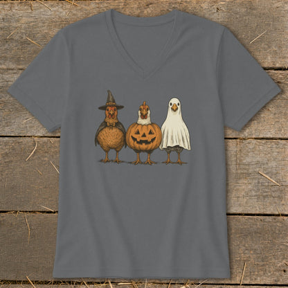 Three chickens dressed as Halloween characters: witch, pumpkin, and ghost.