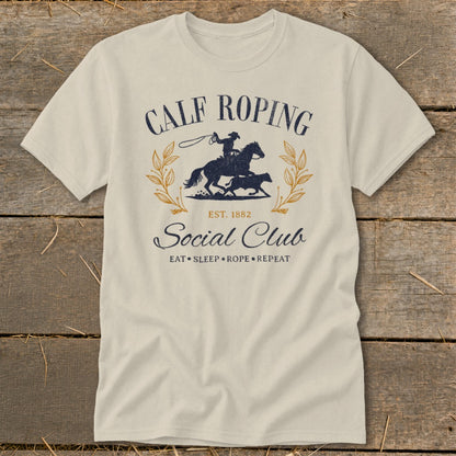 Calf Roping Social Club t-shirt with cowboy on horse and calf graphic.
