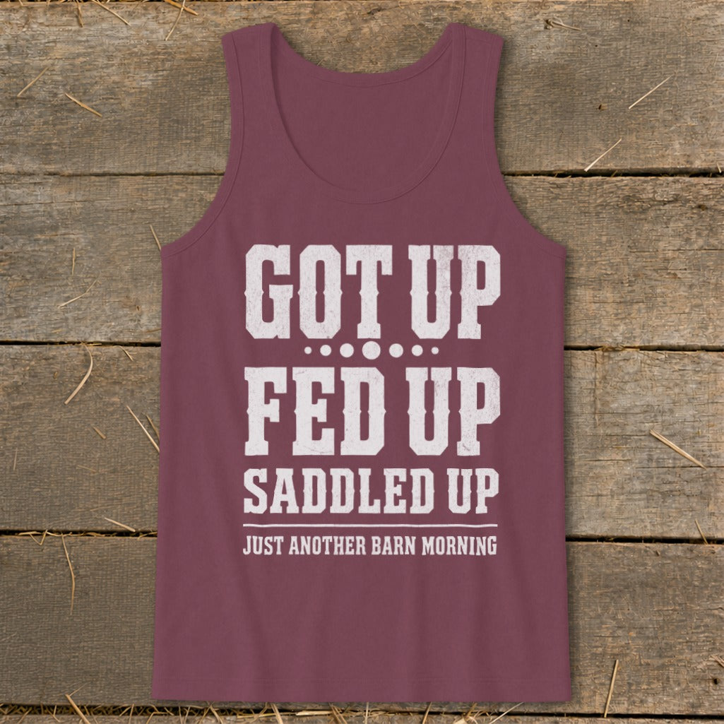 Maroon tank top with white distressed text: "GOT UP FED UP SADDLED UP JUST ANOTHER BARN MORNING"